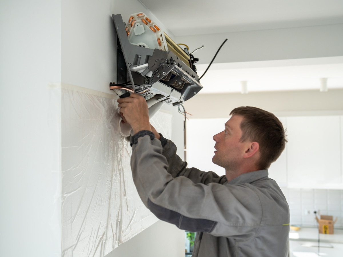HVAC tech installing Mini Split Ductless system